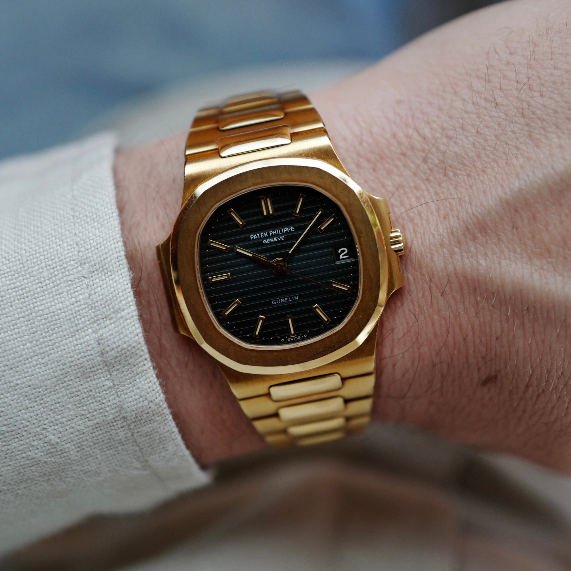 Patek Philippe Yellow Gold Nautilus Watch Ref. 3800 retailed by Gubelin in Top Condition