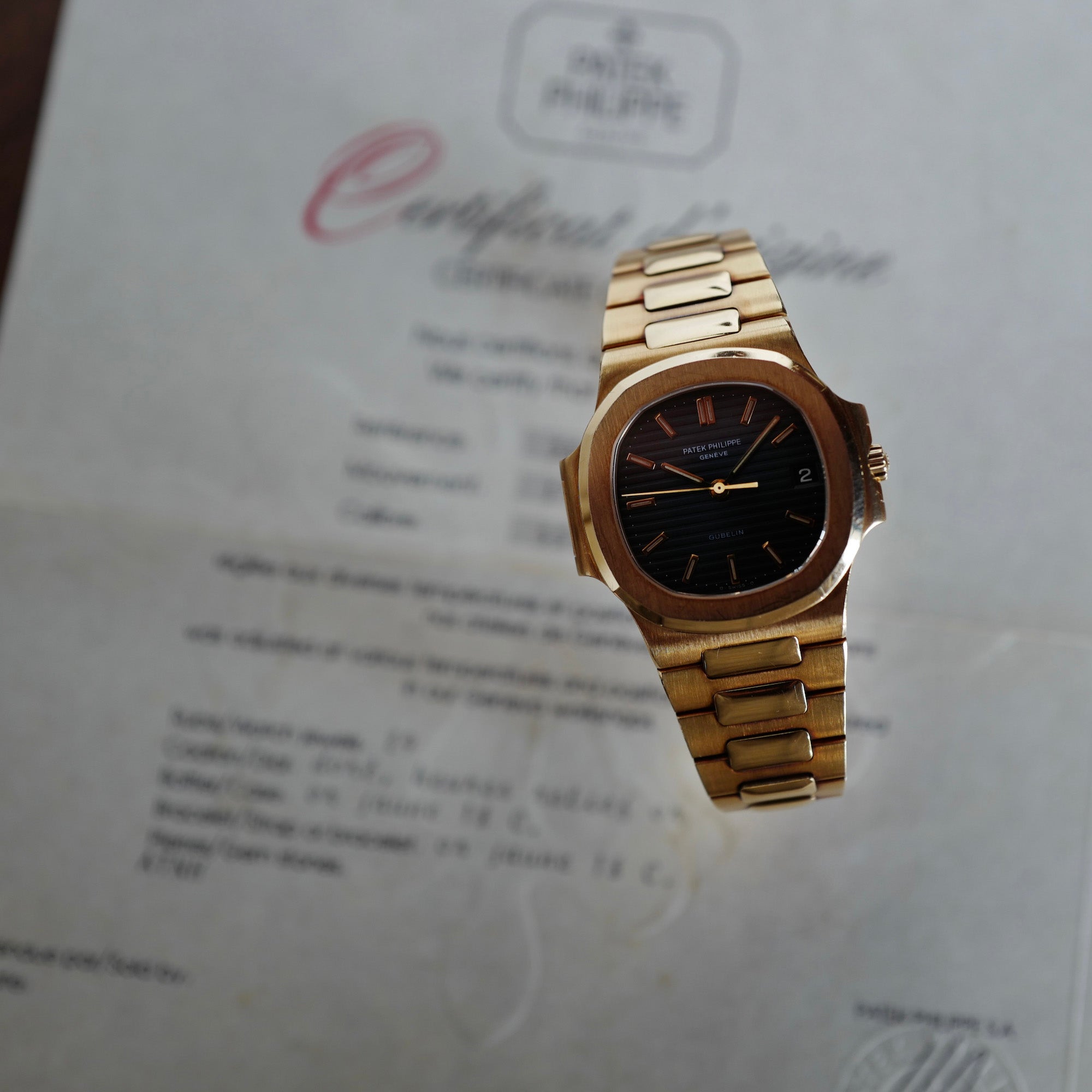Patek Philippe Yellow Gold Nautilus Watch Ref. 3800 retailed by Gubelin in Top Condition
