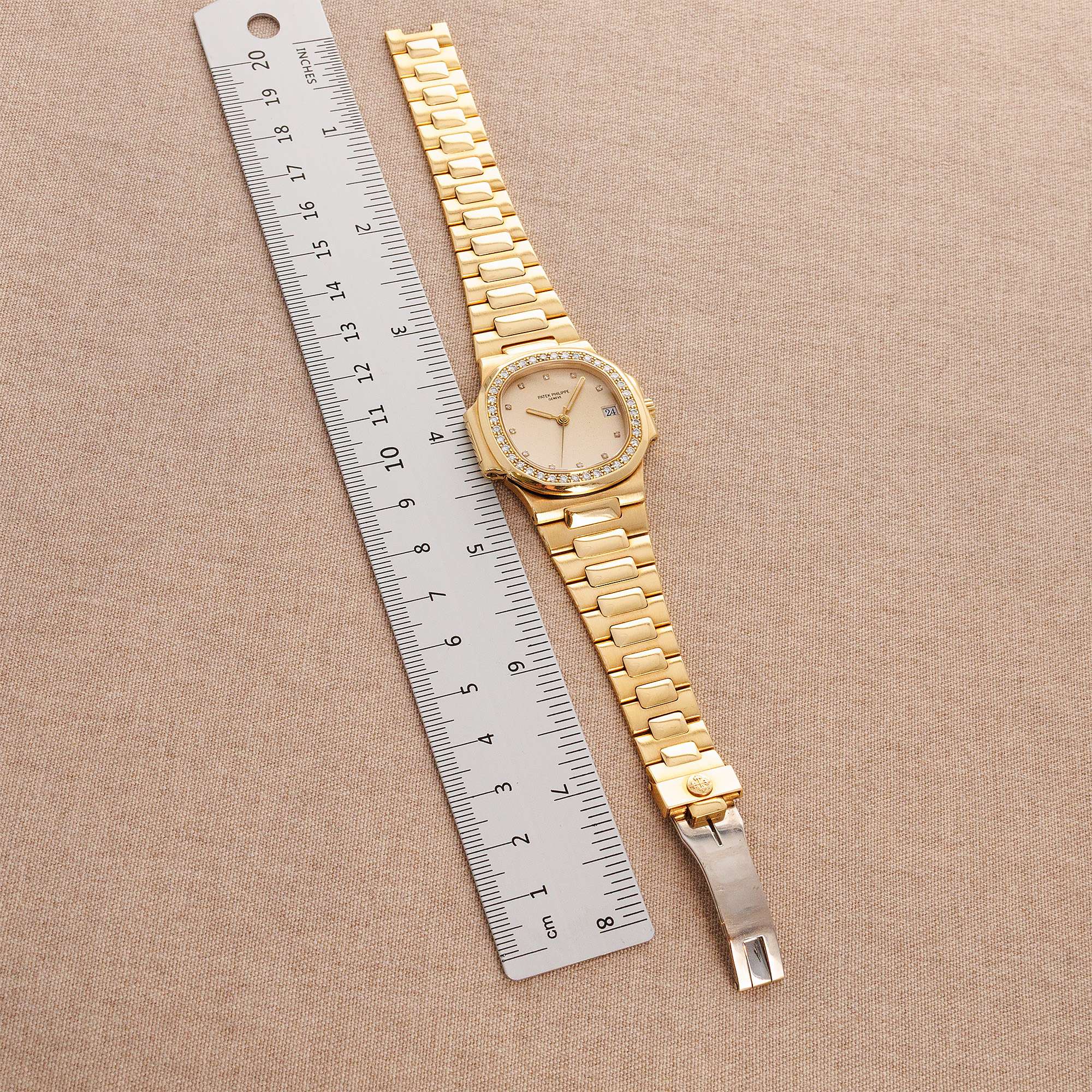 Patek Philippe - Patek Philippe Yellow Gold Nautilus Ref. 3800 with Diamond Bezel and Ceramic Dial - The Keystone Watches