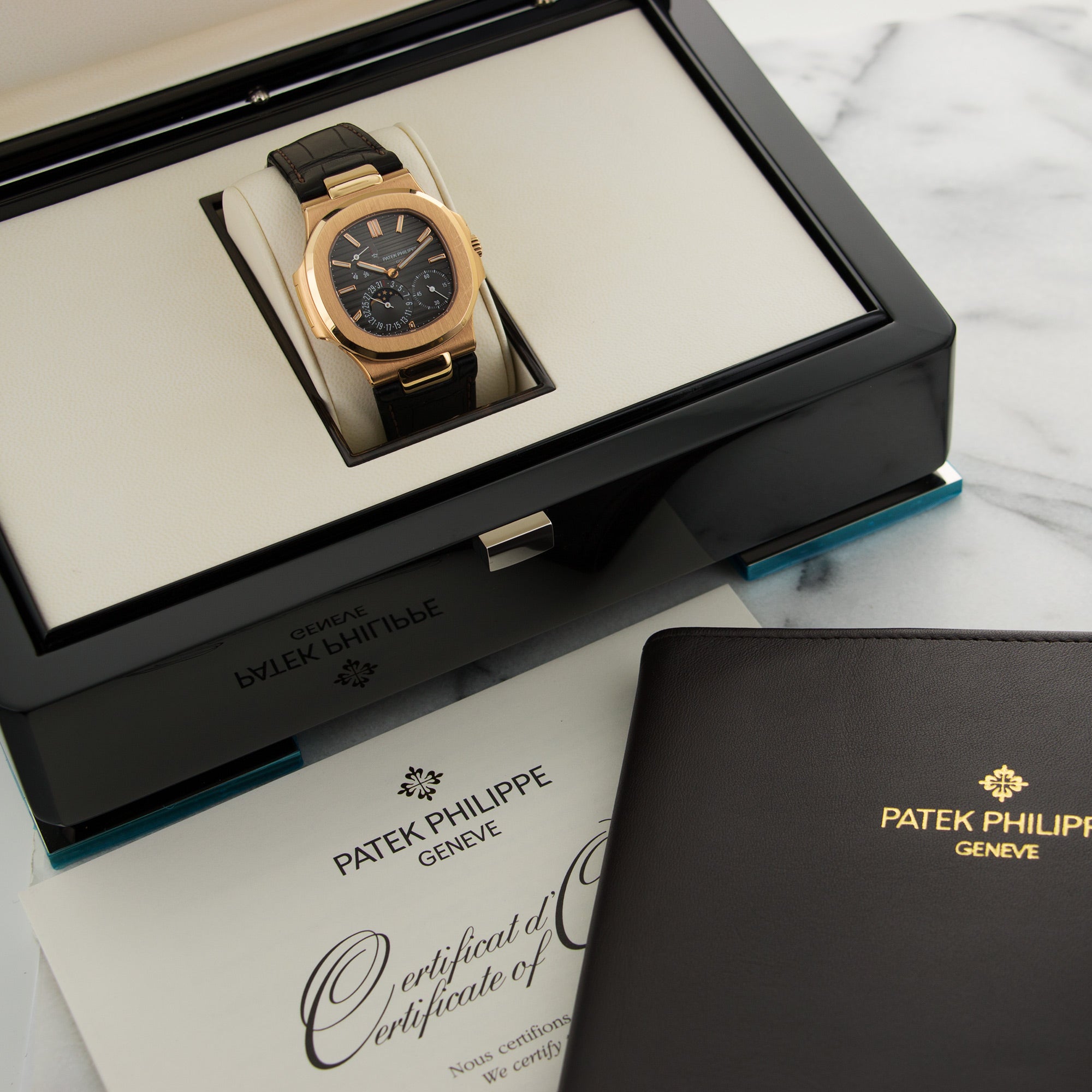Patek Philippe - Patek Philippe Rose Gold Nautilus Moonphase Watch Ref. 5712 - The Keystone Watches