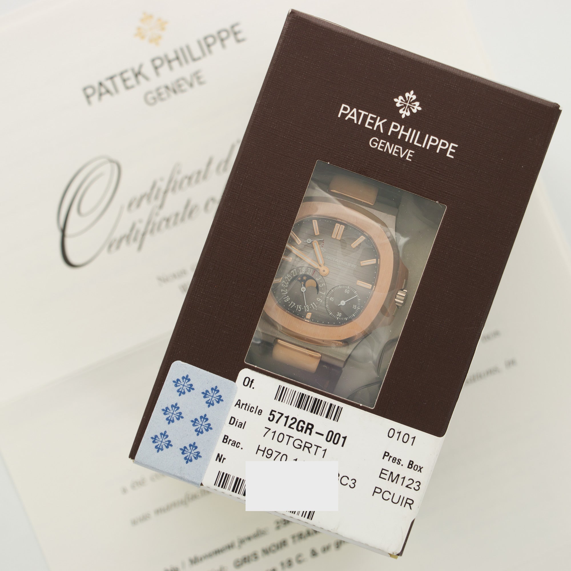 Patek Philippe - Patek Philippe White & Rose Gold Nautilus Moonphase Watch Ref. 5712 - The Keystone Watches