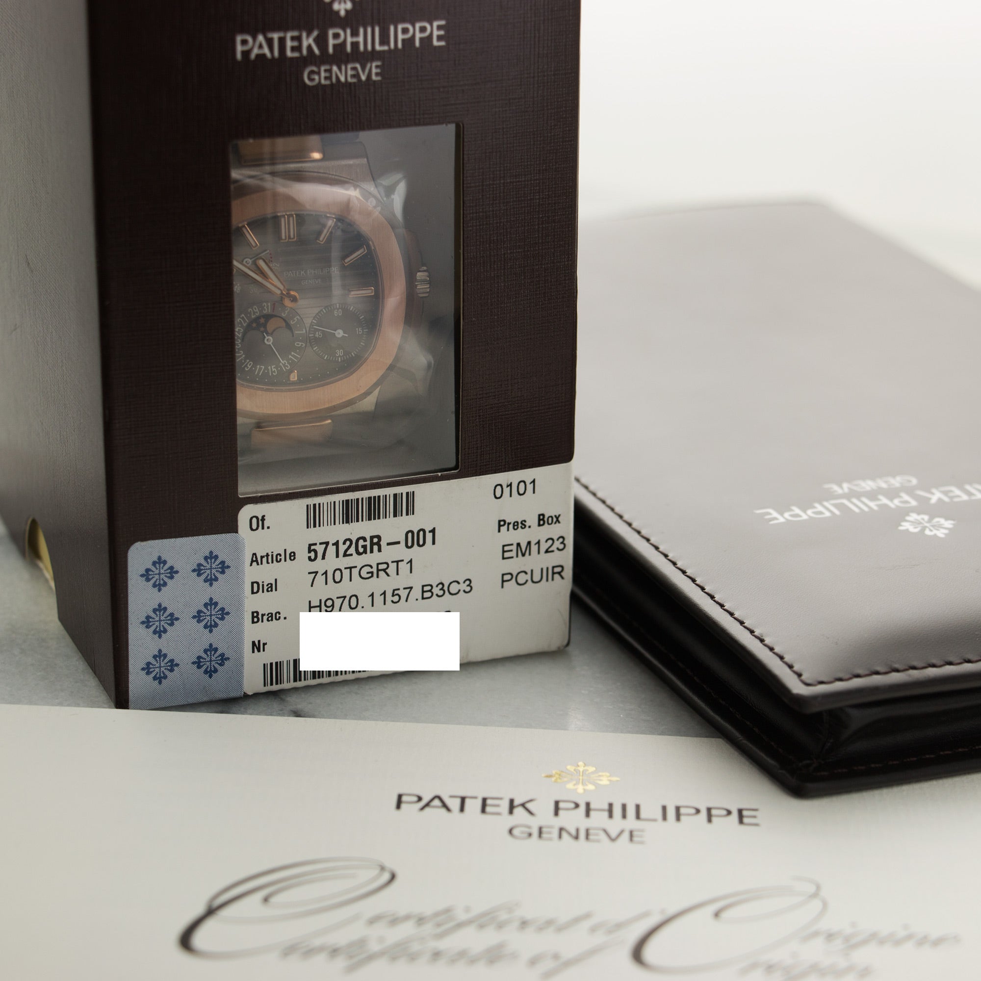 Patek Philippe - Patek Philippe White & Rose Gold Nautilus Moonphase Watch Ref. 5712 - The Keystone Watches
