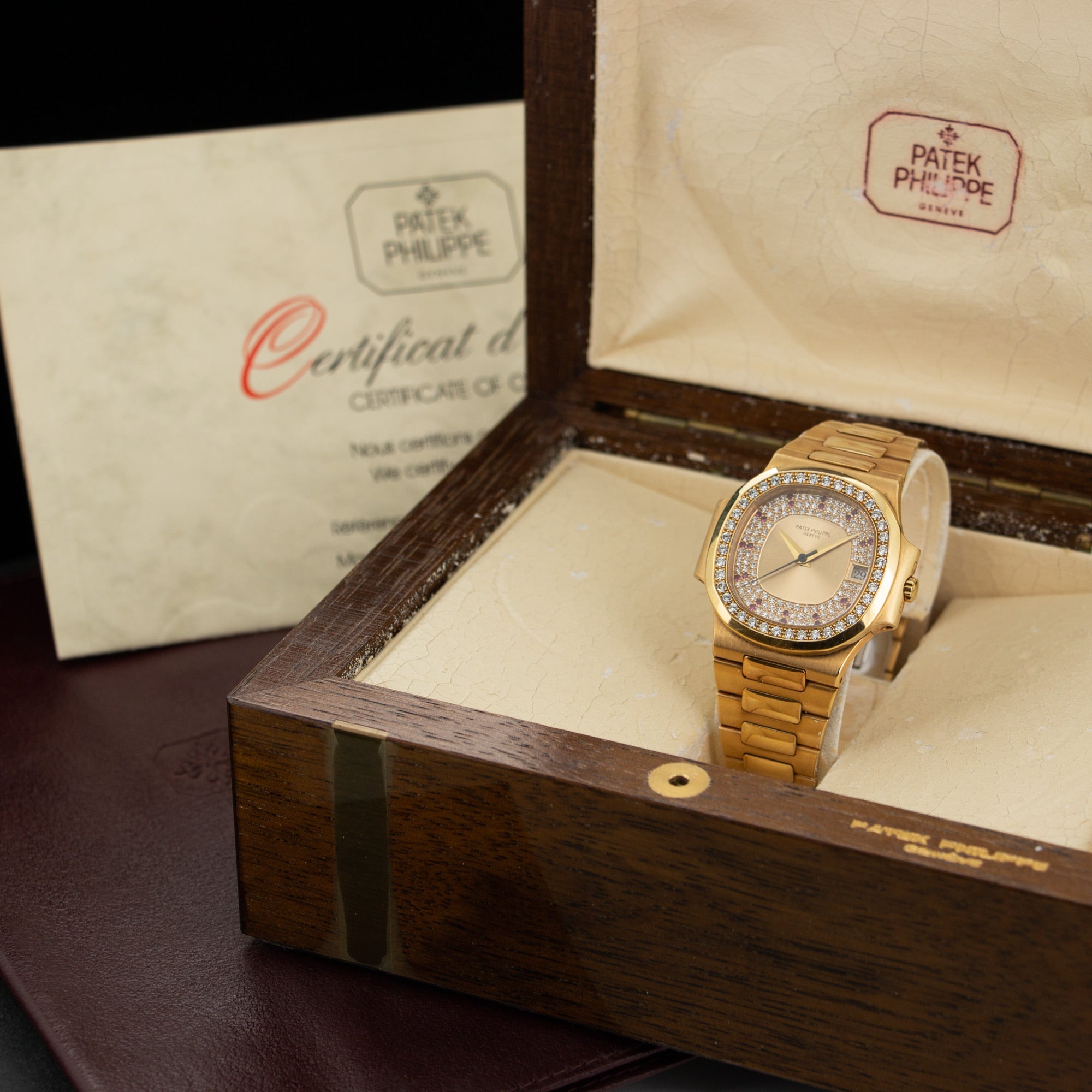 Patek Philippe - Patek Philippe Yellow Gold Nautilus Diamond & Ruby Watch Ref. 3800 - The Keystone Watches