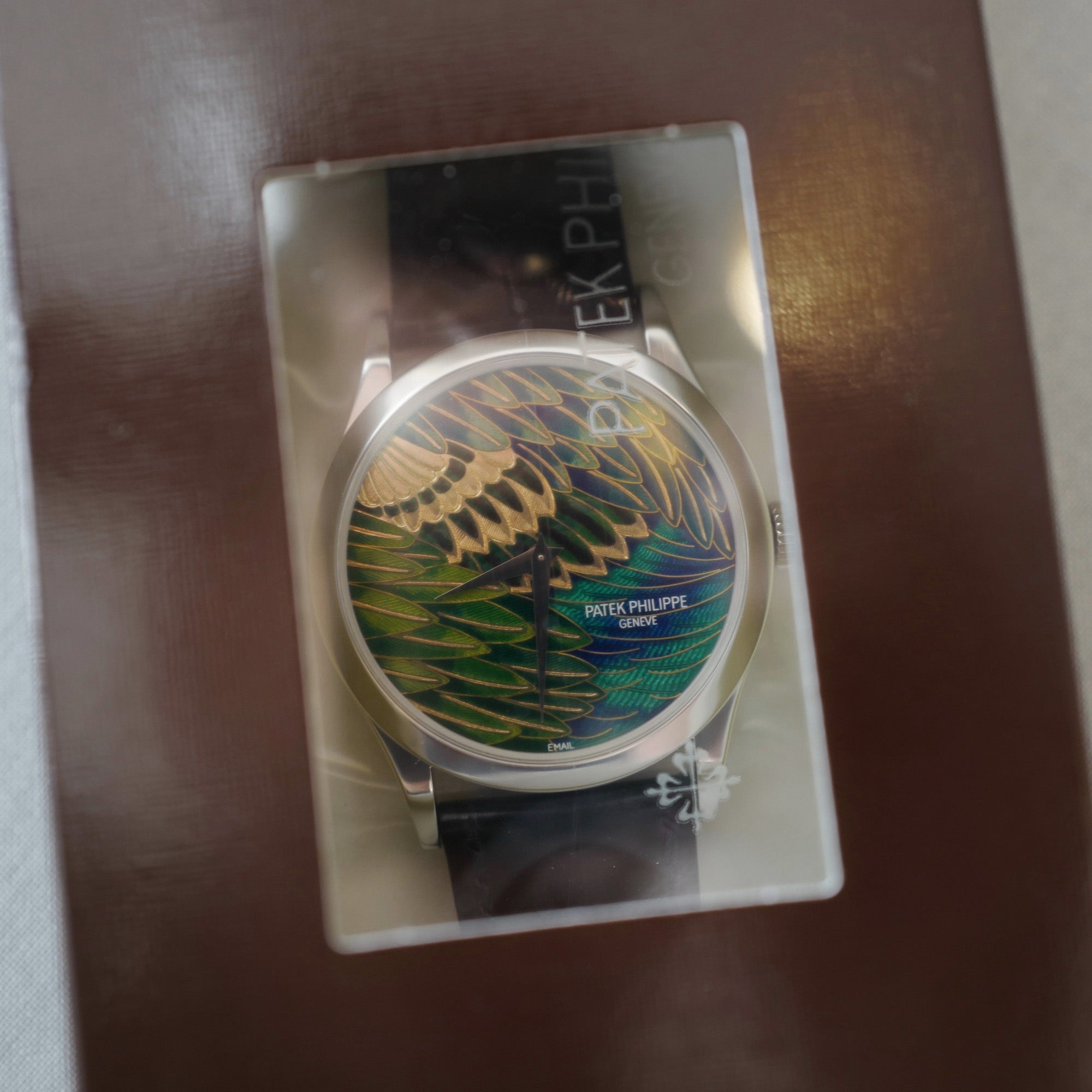Patek Philippe - Patek Philippe Platinum Handcrafts Cloisonne Peacock Watch, Ref. 5077 Unworn and Double Sealed - The Keystone Watches