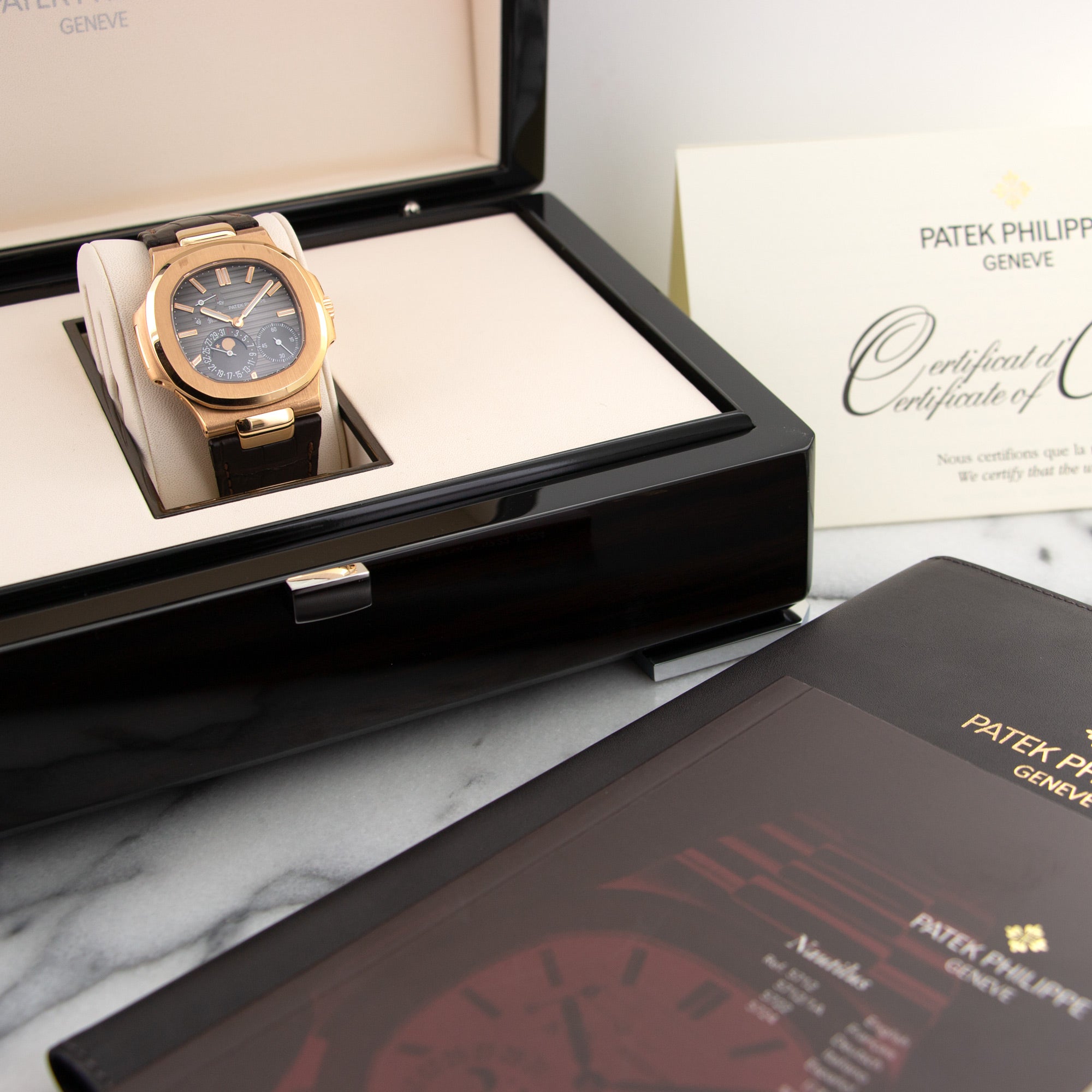 Patek Philippe - Patek Philippe Rose Gold Nautilus Moonphase Watch Ref. 5712 - The Keystone Watches