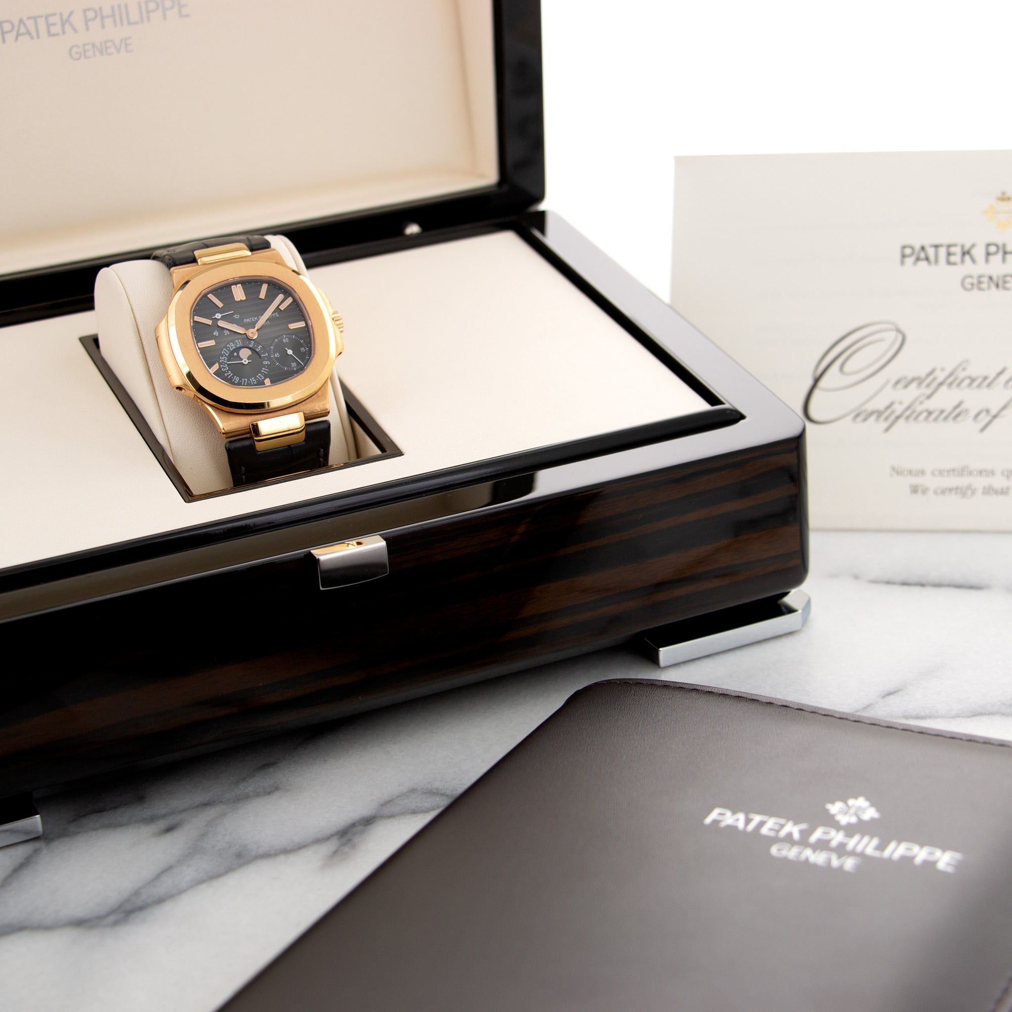 Patek Philippe - Patek Philippe Rose Gold Nautilus Moonphase Watch Ref. 5712 - The Keystone Watches
