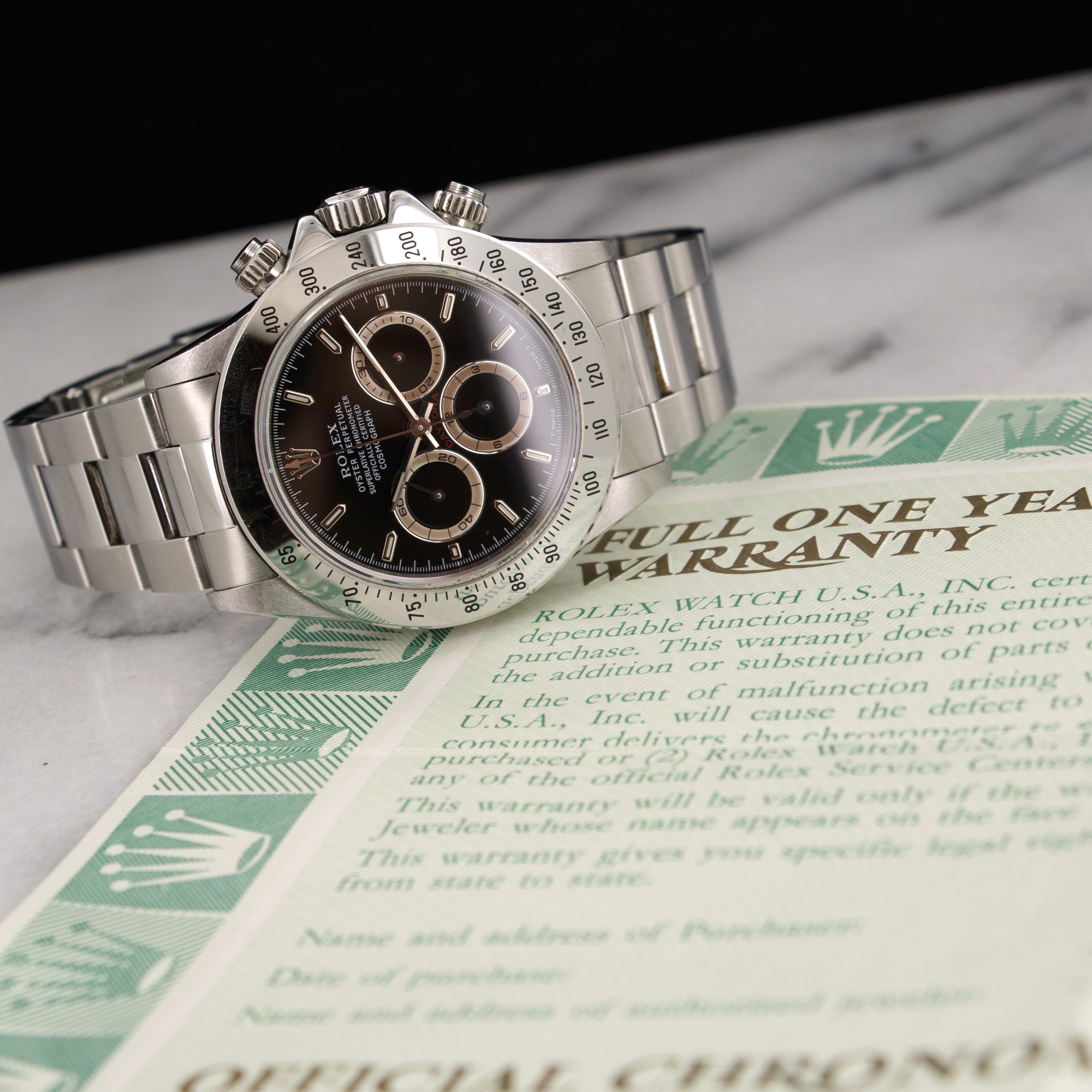 Rolex - Rolex Daytona Cosmograph Patrizzi Watch Ref. 16520 with Original Warranty Paper - The Keystone Watches