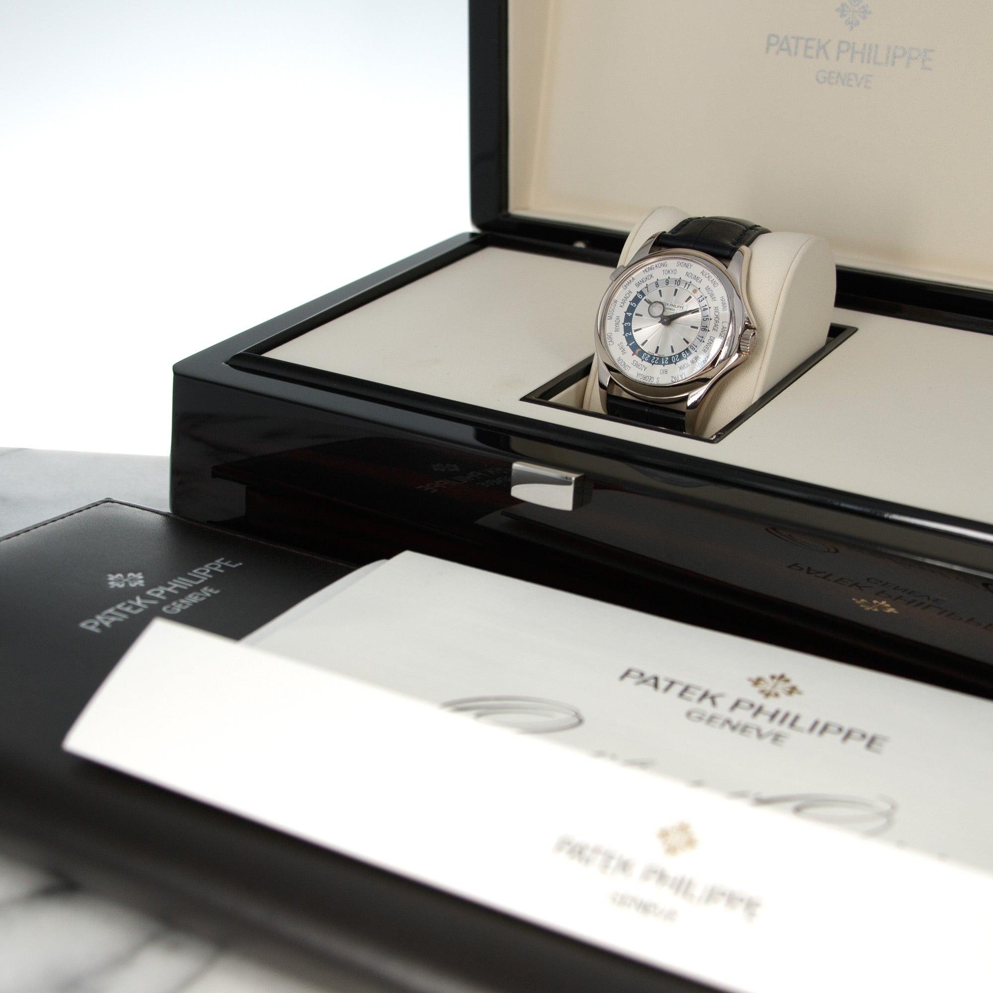 Patek Philippe - Patek Philippe White Gold World Time Ref. 5130, with Original Box and Papers - The Keystone Watches