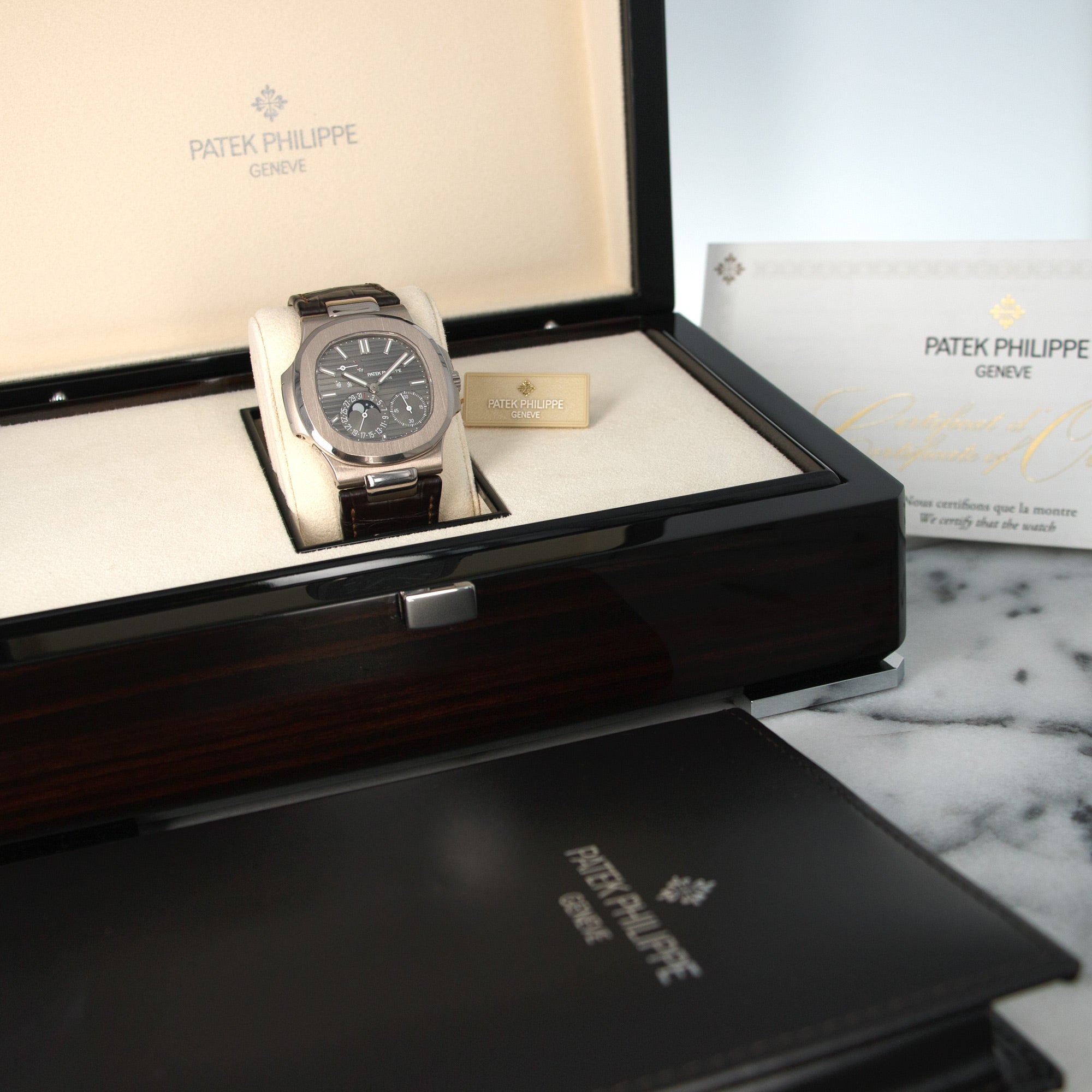 Patek Philippe - Patek Philippe White Gold Nautilus Moonphase Watch Ref. 5712 - The Keystone Watches