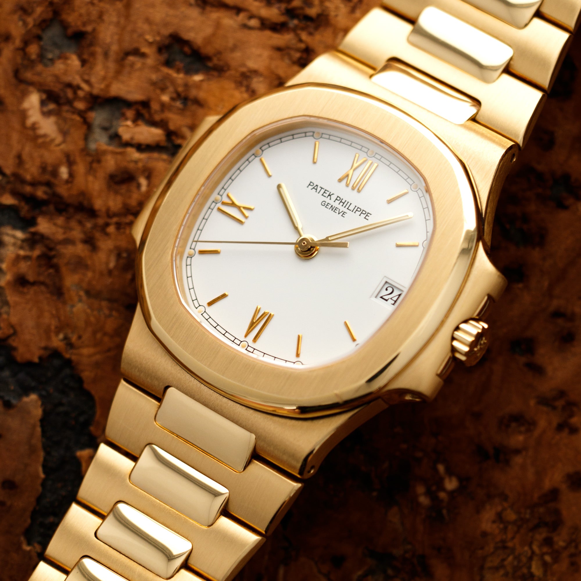 Patek Philippe - Patek Philippe Yellow Gold Nautilus Watch Ref. 3800 with Rare White Roman Numerals Dial - The Keystone Watches