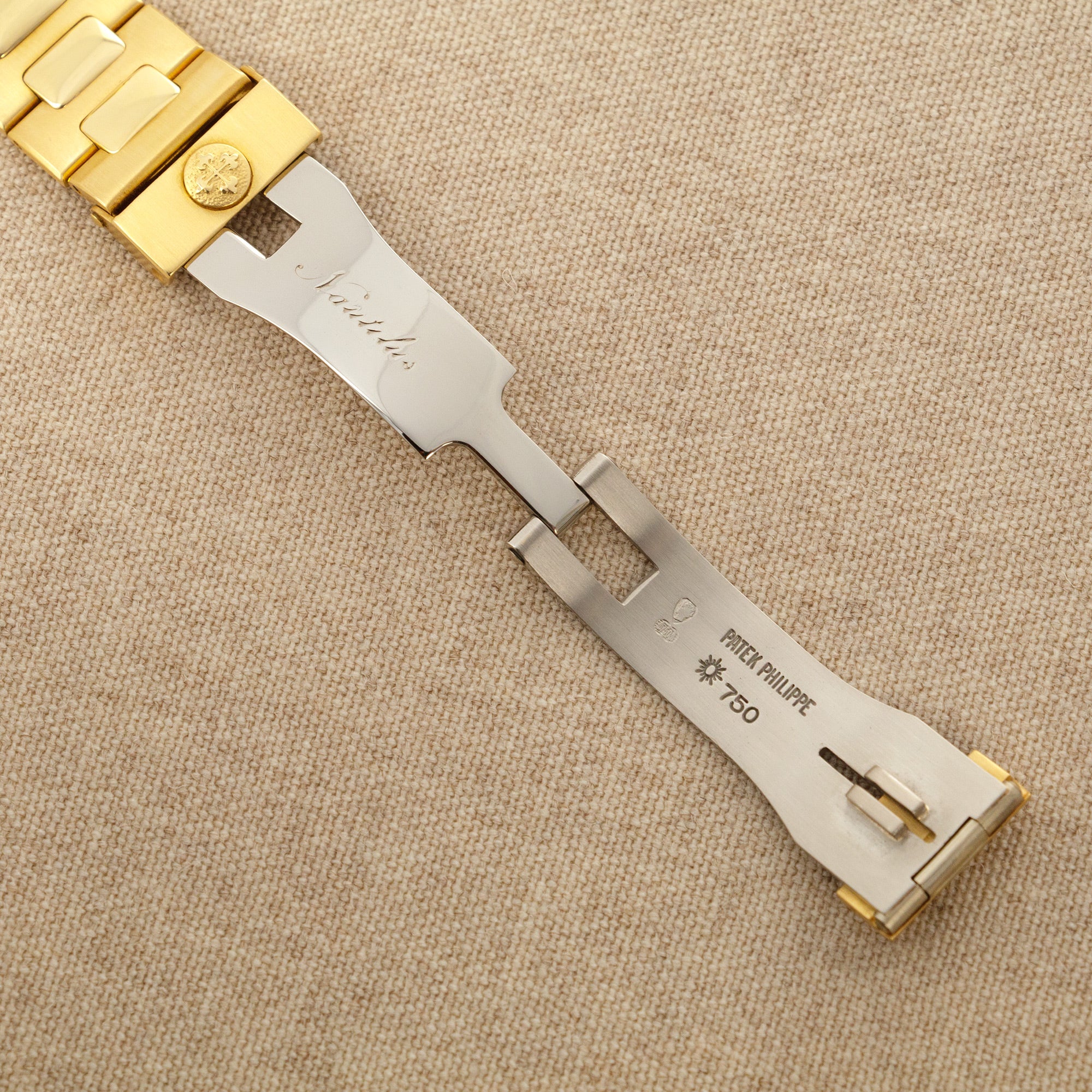 Patek Philippe - Patek Philippe Yellow Gold Nautilus Watch Ref. 3800 with Rare White Roman Numerals Dial - The Keystone Watches