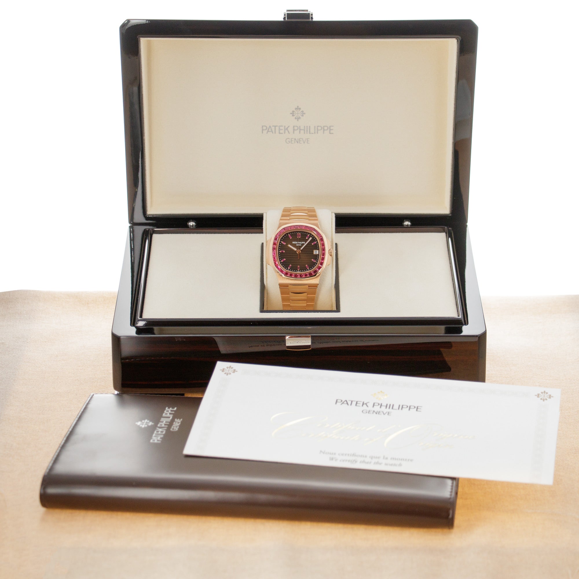 Patek Philippe - Patek Philippe Rose Gold Nautilus Watch Ref. 5723 with Factory Ruby Dial and Bezel - The Keystone Watches