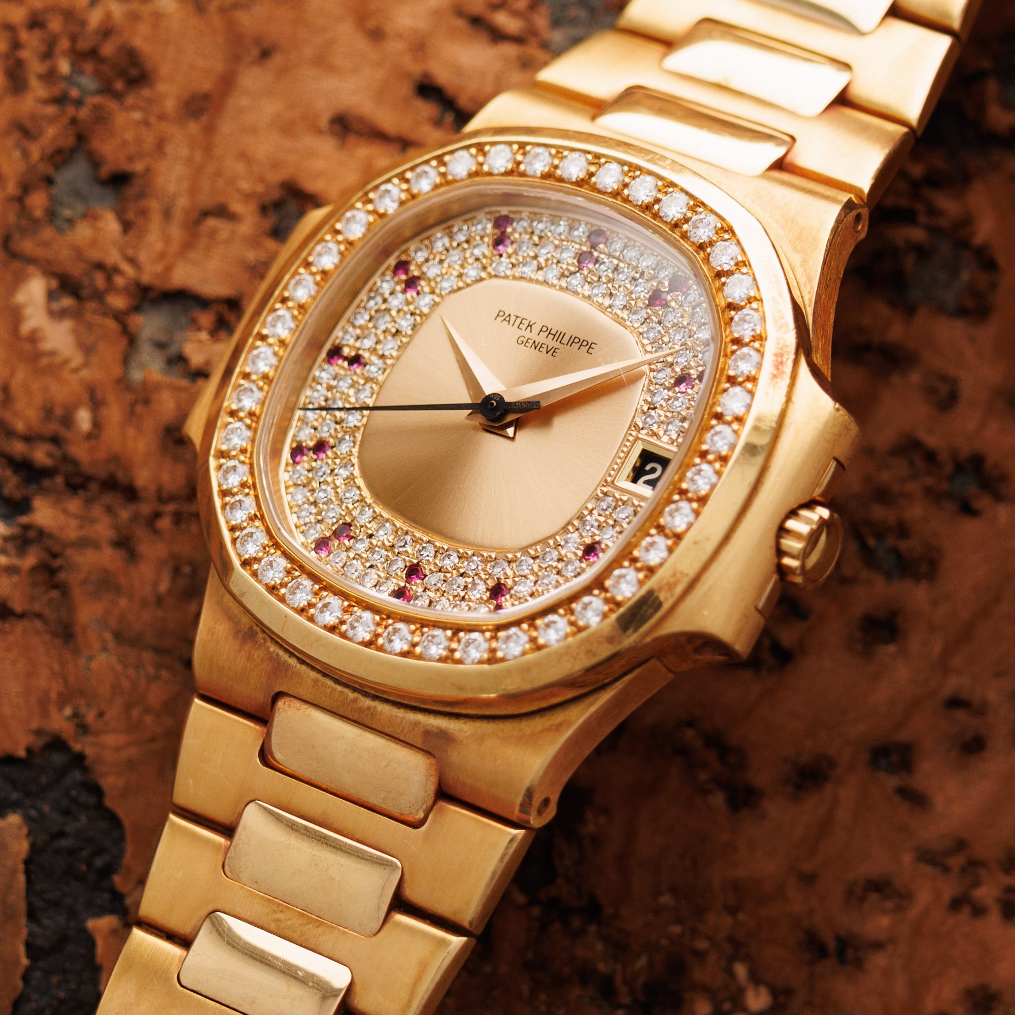 Patek Philippe - Patek Philippe Yellow Gold Nautilus Ref. 3800 with Factory Diamond and Ruby Dial - The Keystone Watches
