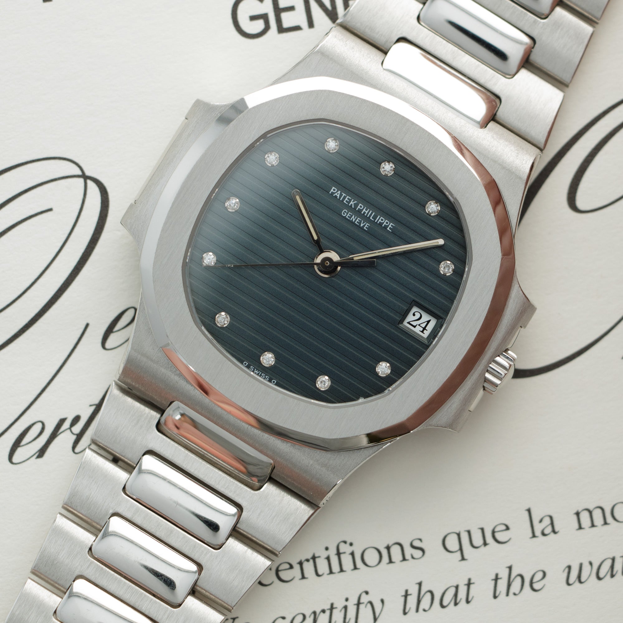 Patek Philippe - Patek Philippe Platinum Nautilus Watch Ref. 3800 with Original Warranty - The Keystone Watches