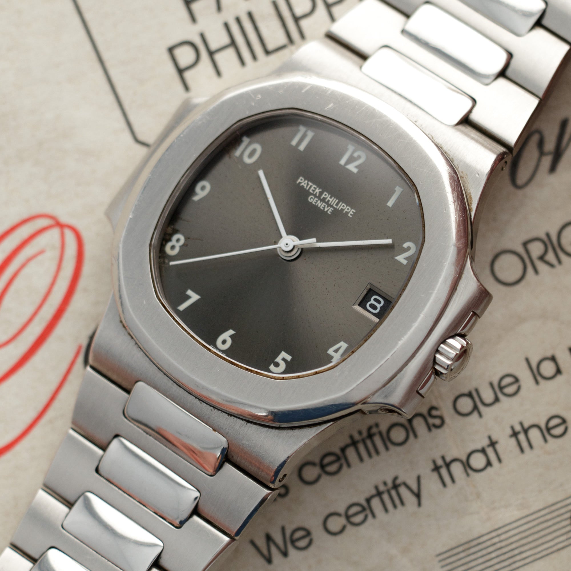 Patek Philippe Steel Nautilus Ref. 3800 with Rare Arabic Numeral Dial and Original Warranty