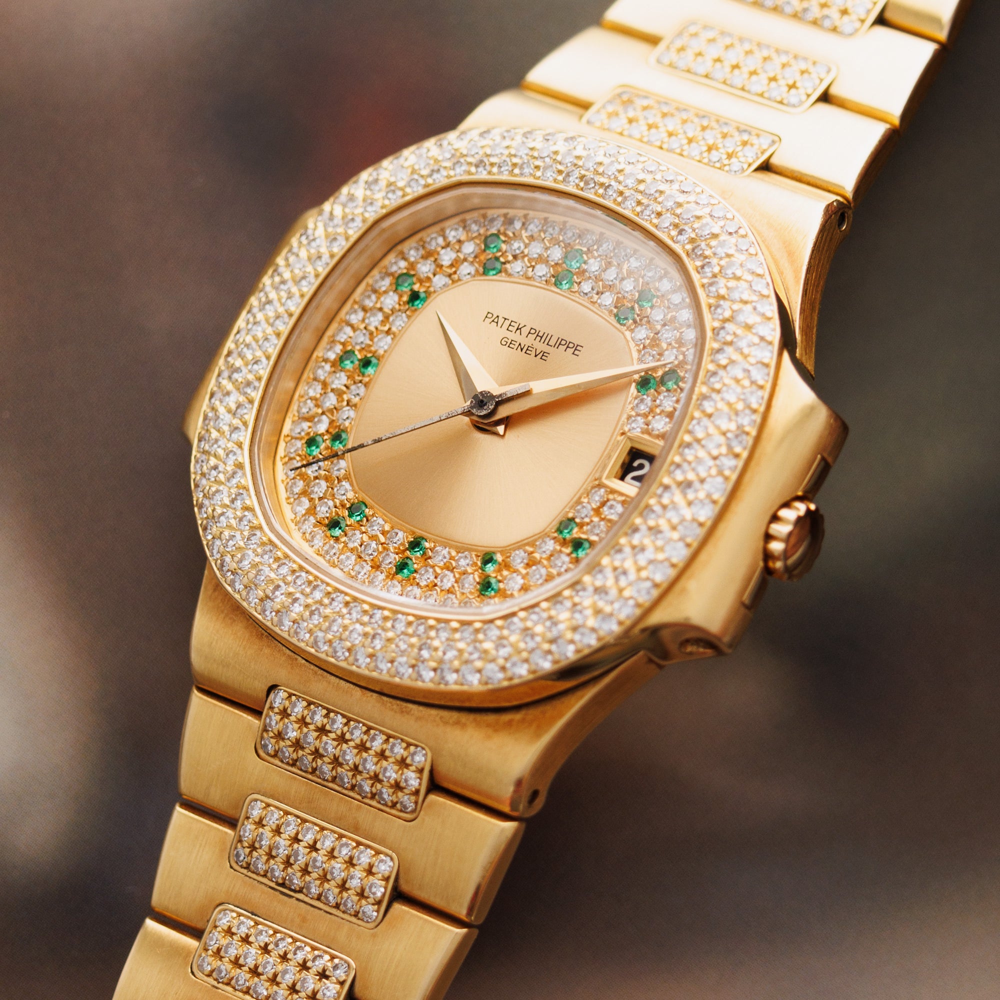 Patek Philippe Yellow Gold Nautilus Ref. 3800/105 with Pave Diamond and Emerald