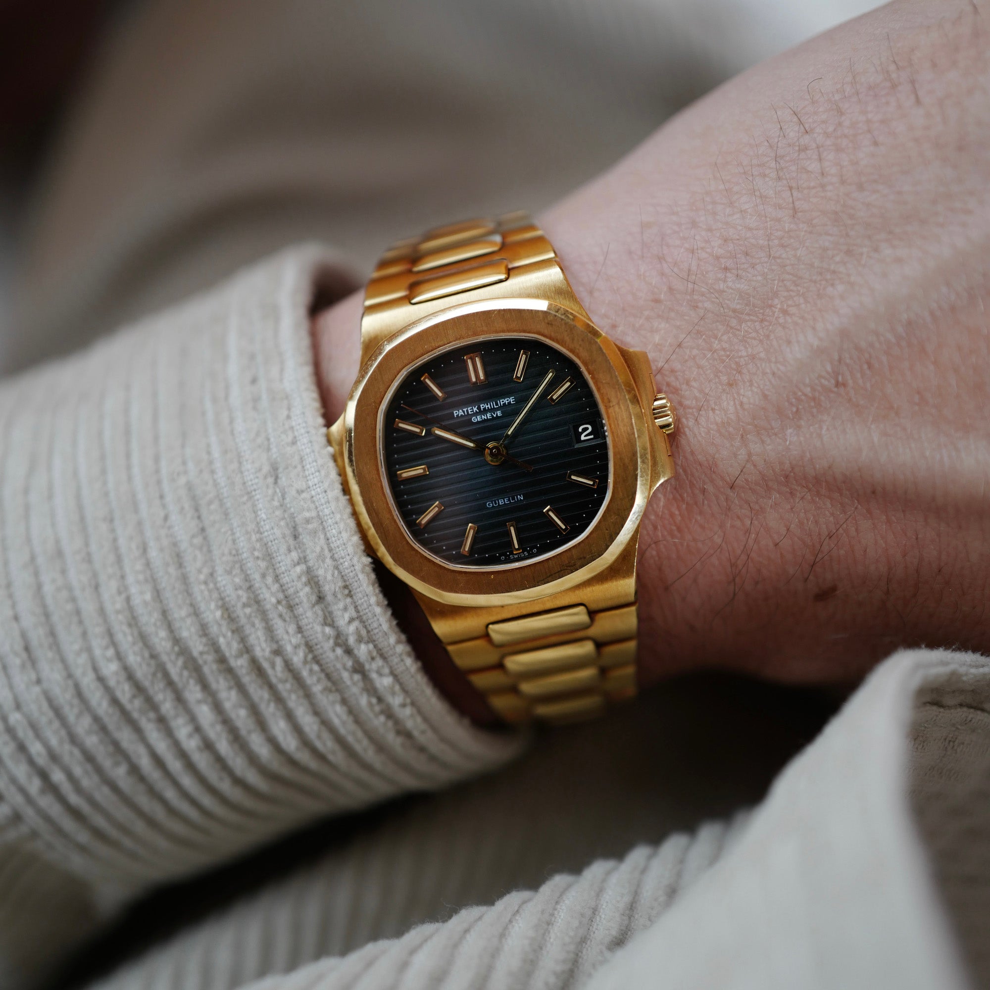 Patek Philippe Yellow Gold Nautilus Watch Ref. 3800 retailed by Gubelin  in Top Condition