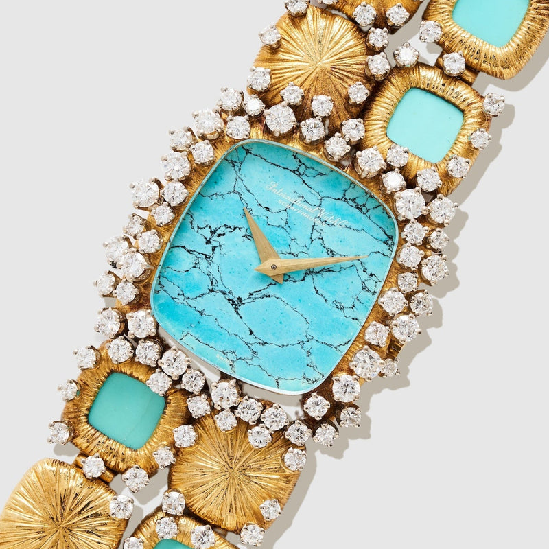 IWC Sculptural watch with turquoise face and gold casing with diamonds
