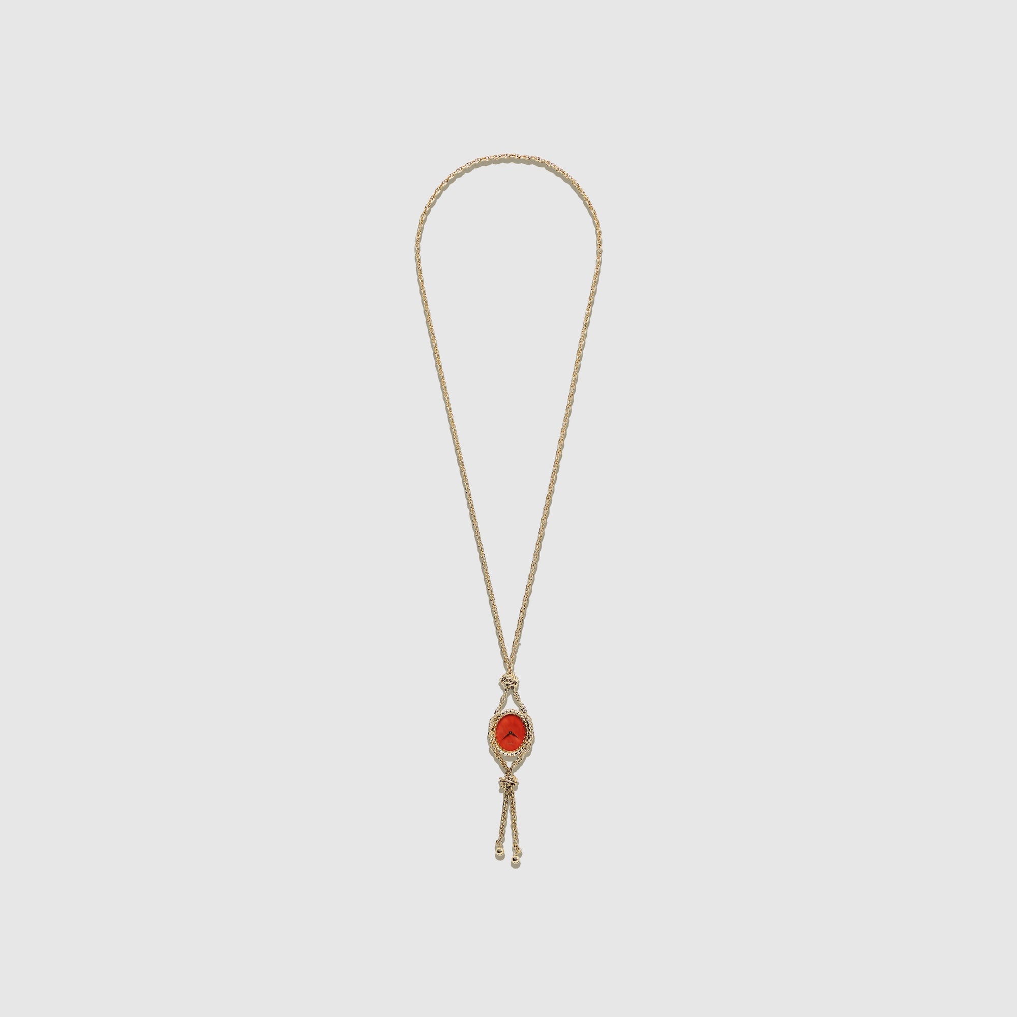 Piaget Yellow Gold Pendent with Coral Dial