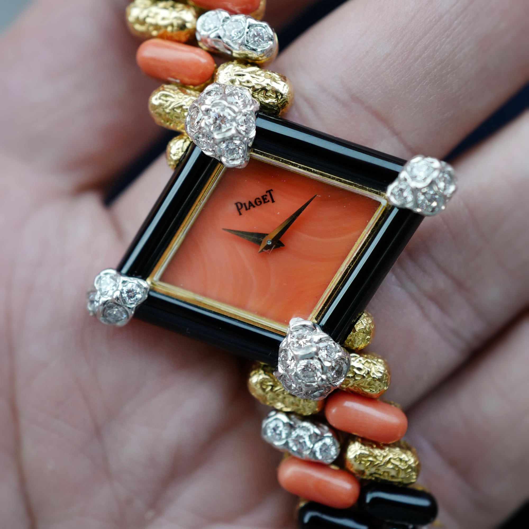 Piaget Yellow Gold Coral, Onyx, Diamond Watch, Circa 1970s