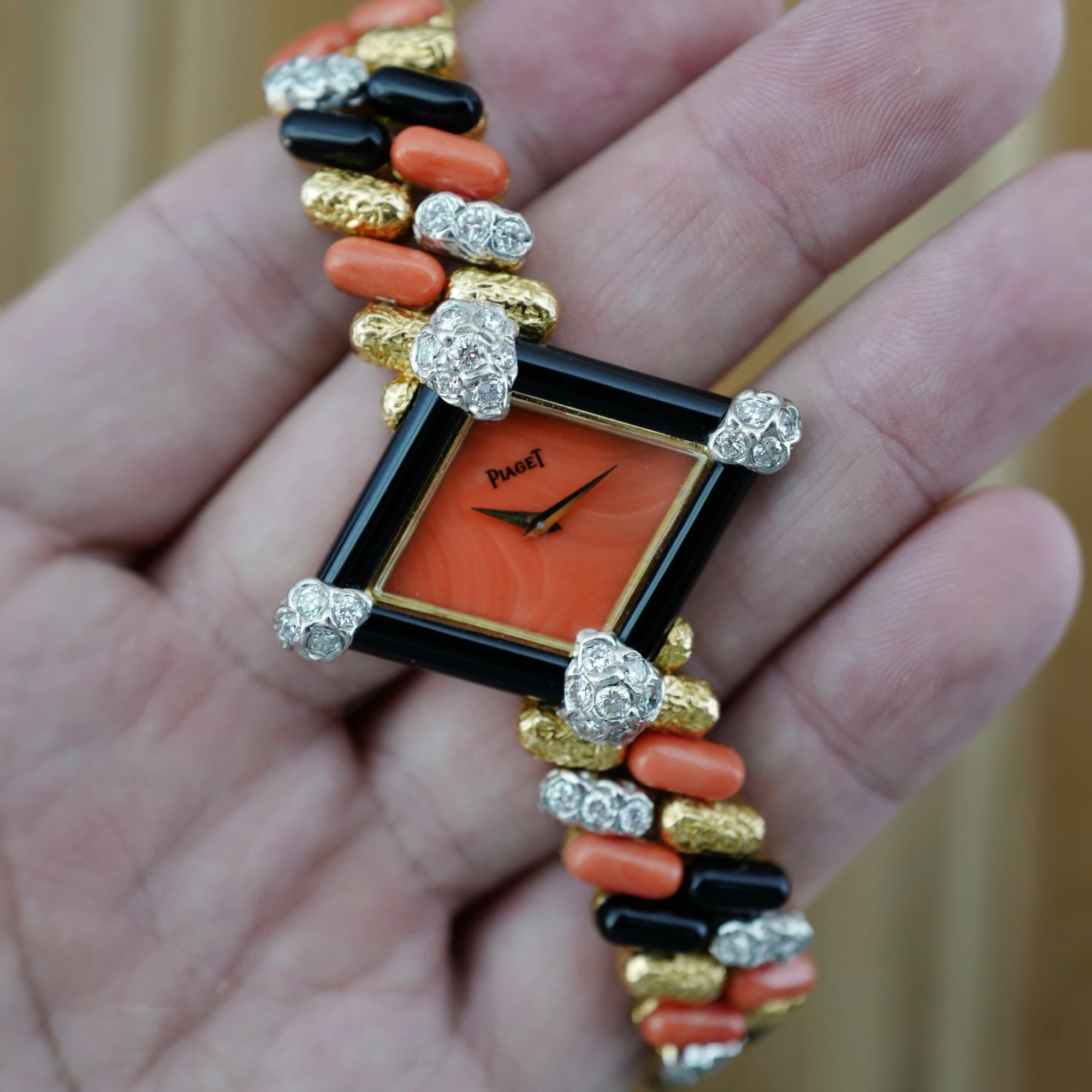 Piaget Yellow Gold Coral, Onyx, Diamond Watch, Circa 1970s