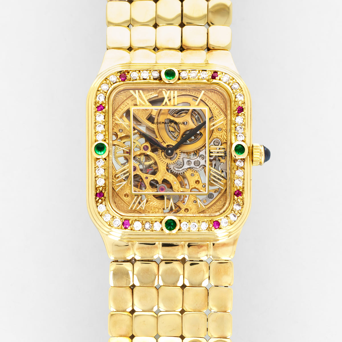 Audemars Piguet Yellow Gold Square Skeleton Watch with Diamonds, Emeralds and Rubies