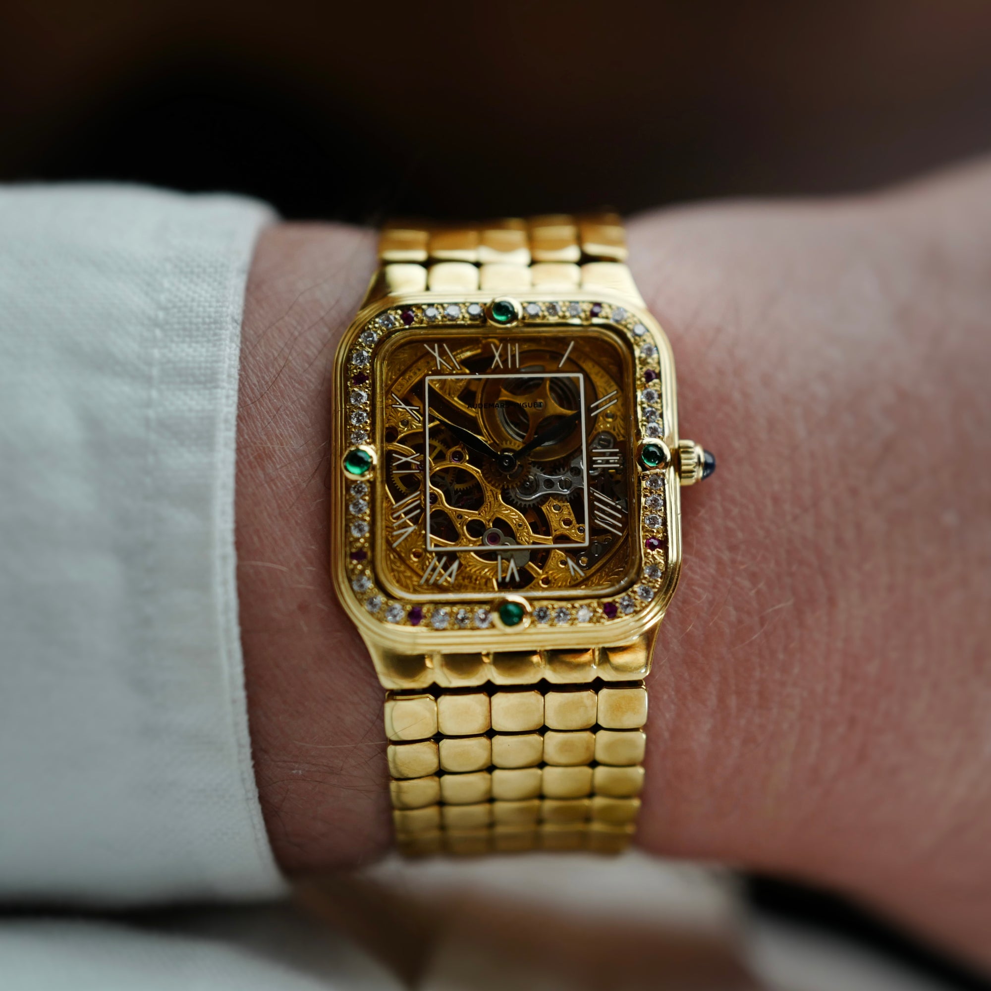 Audemars Piguet Yellow Gold Square Skeleton Watch with Diamonds, Emeralds and Rubies