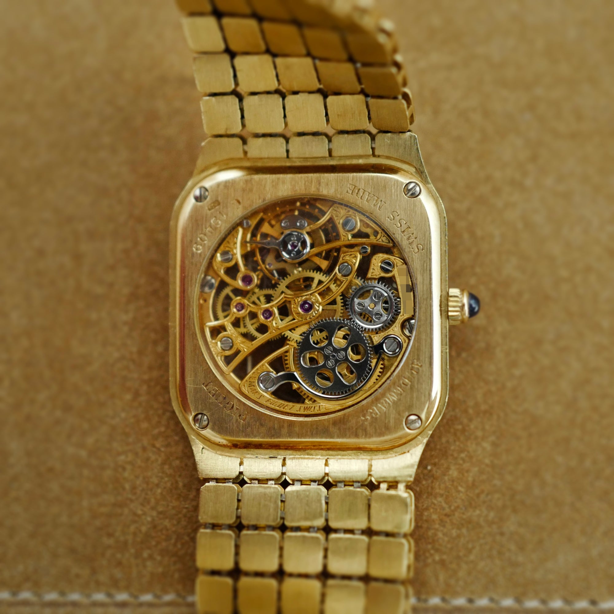 Audemars Piguet Yellow Gold Square Skeleton Watch with Diamonds, Emeralds and Rubies