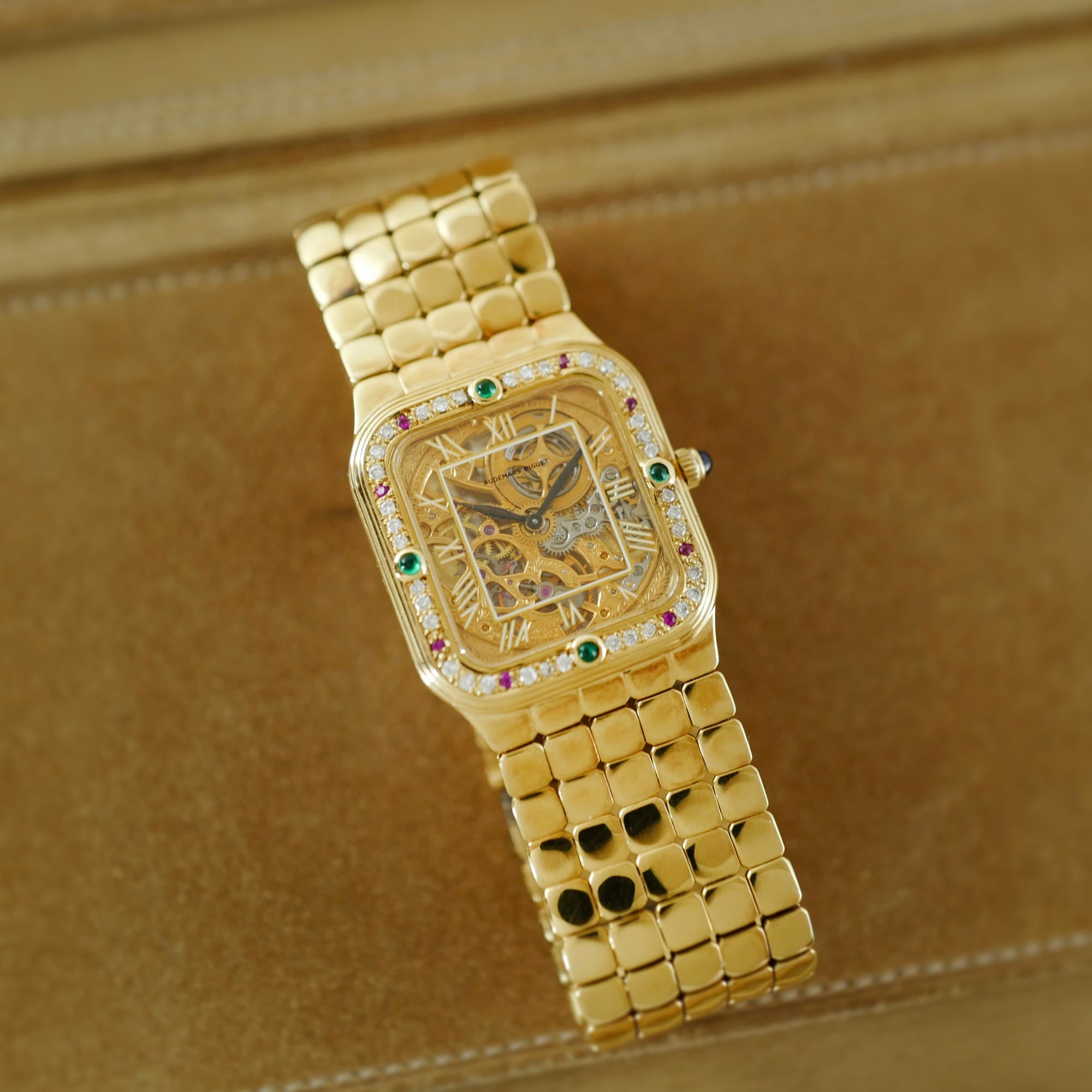 Audemars Piguet Yellow Gold Square Skeleton Watch with Diamonds, Emeralds and Rubies