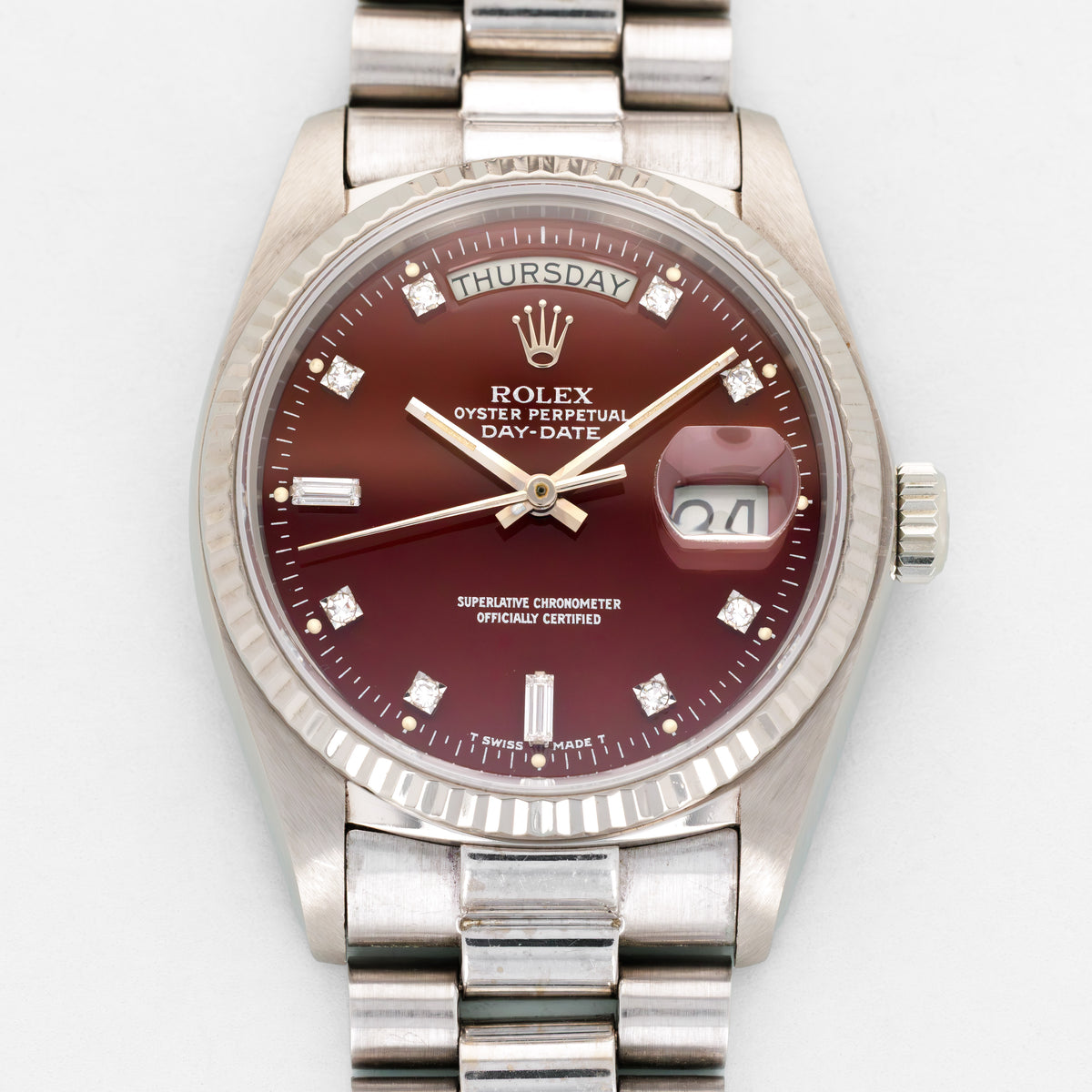 Rolex White Gold Day-Date Oxblood Silver Print Watch Ref. 18039