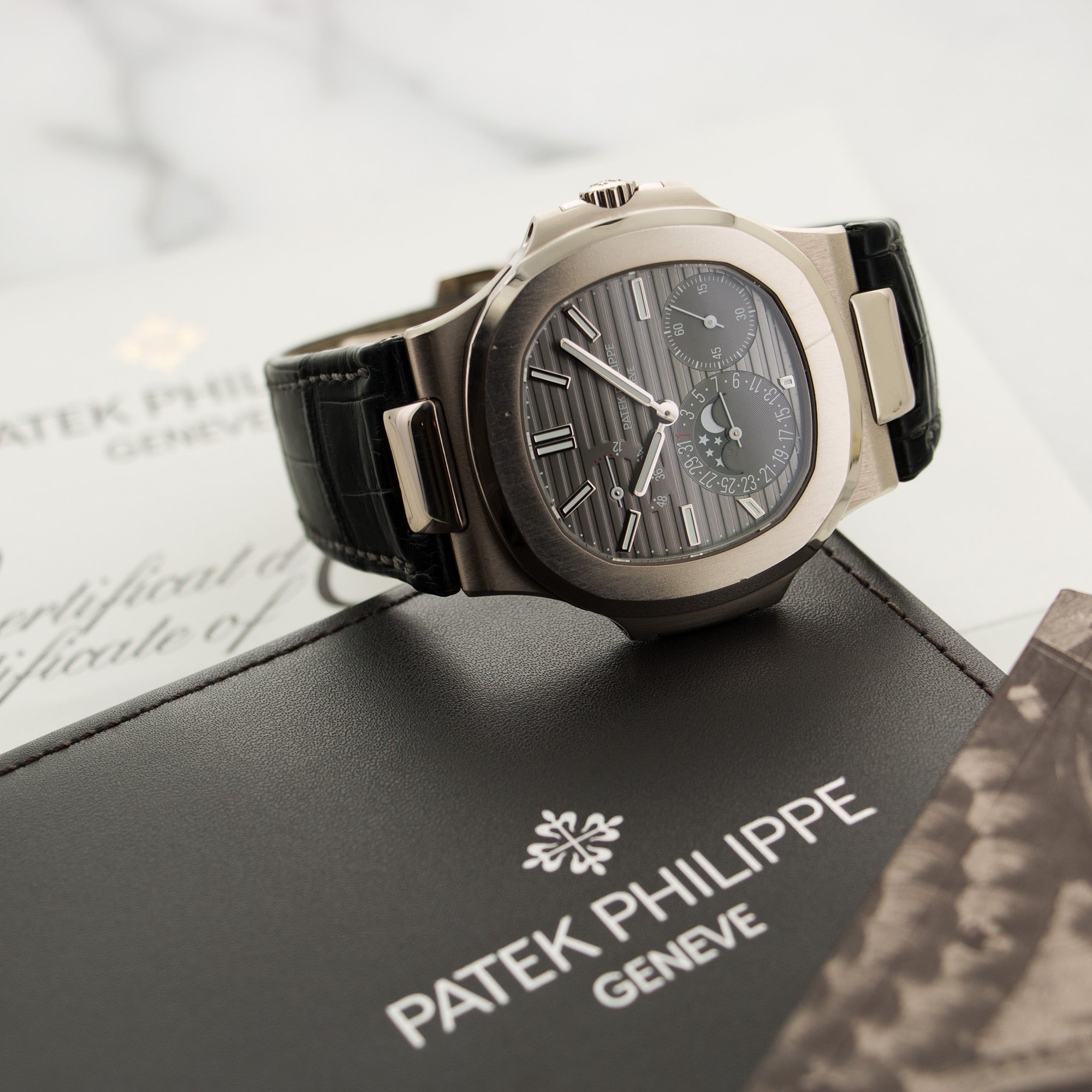 Patek Philippe - Patek Philippe White Gold Nautilus Moonphase Watch Ref. 5712 - The Keystone Watches