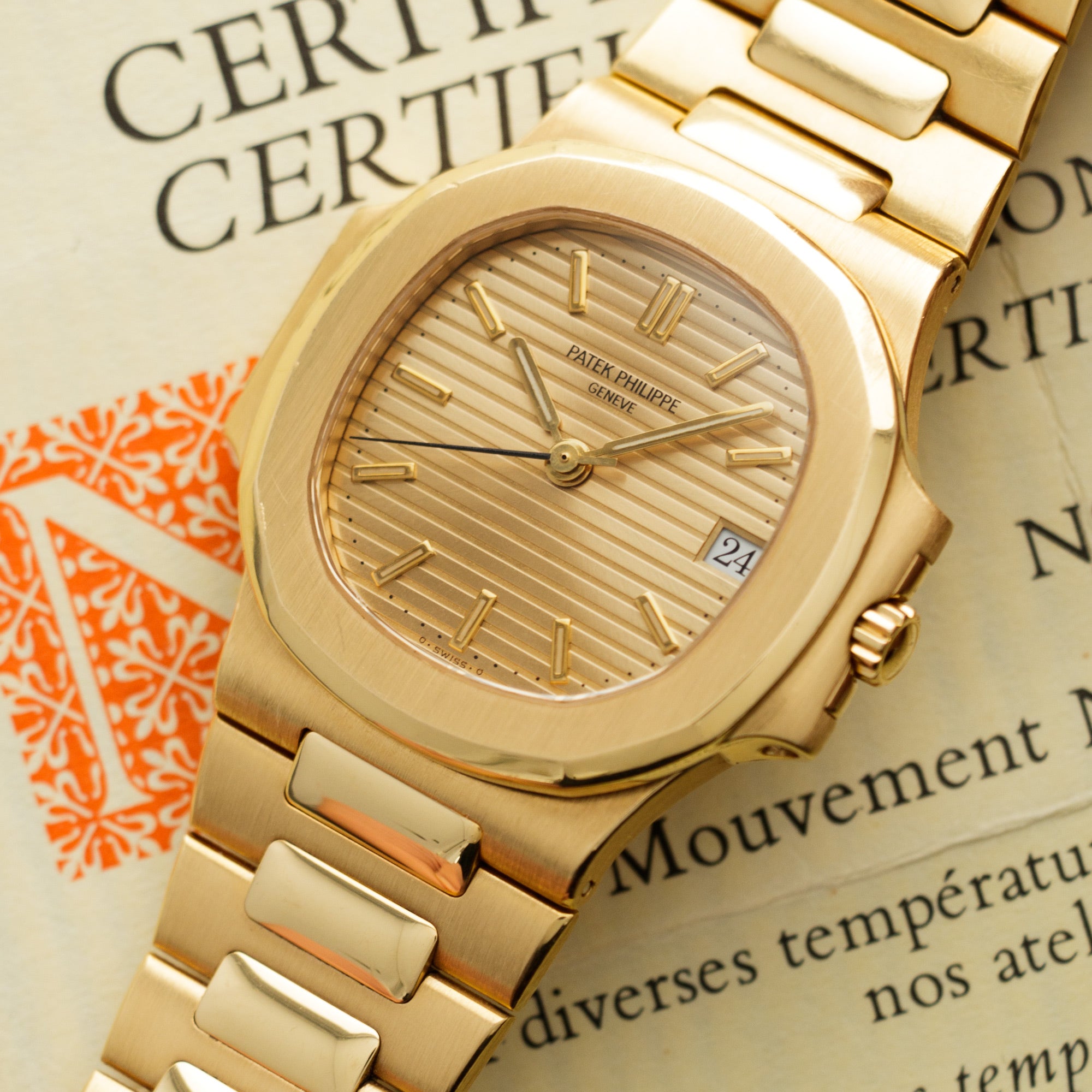 Patek Philippe - Patek Philippe Yellow Gold Nautilus Ref. 3800 with Original Warranty - The Keystone Watches