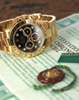 Rolex Daytona 16528G 18k YG  Excellent Overall Condition, No Notable Signs of Wear Unisex 18k YG Black with Diamond Markers 40 mm Automatic 1994/5 Yellow Gold Original Warranty Paper 