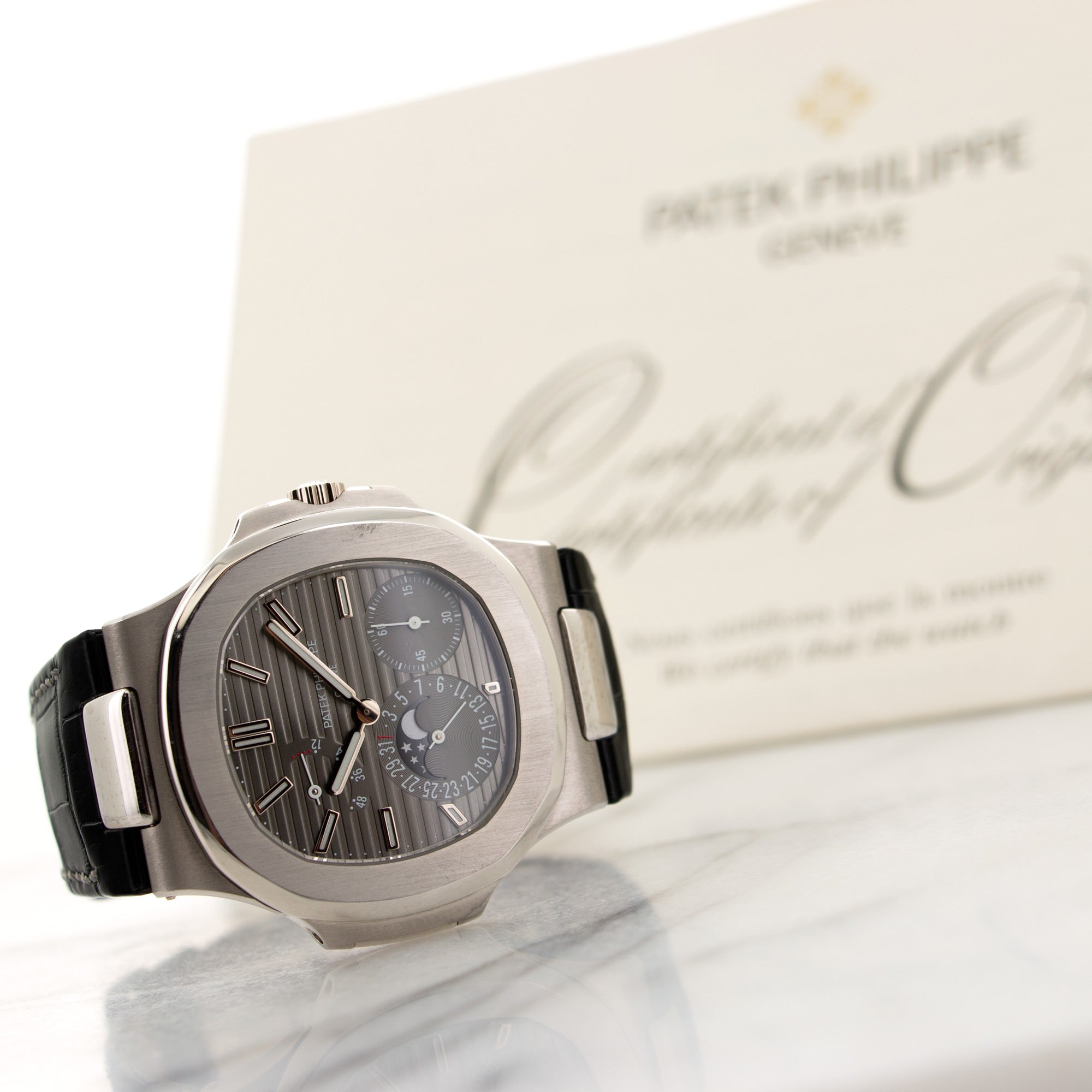 Patek Philippe - Patek Philippe White Gold Nautilus Moonphase Watch Ref. 5712 - The Keystone Watches